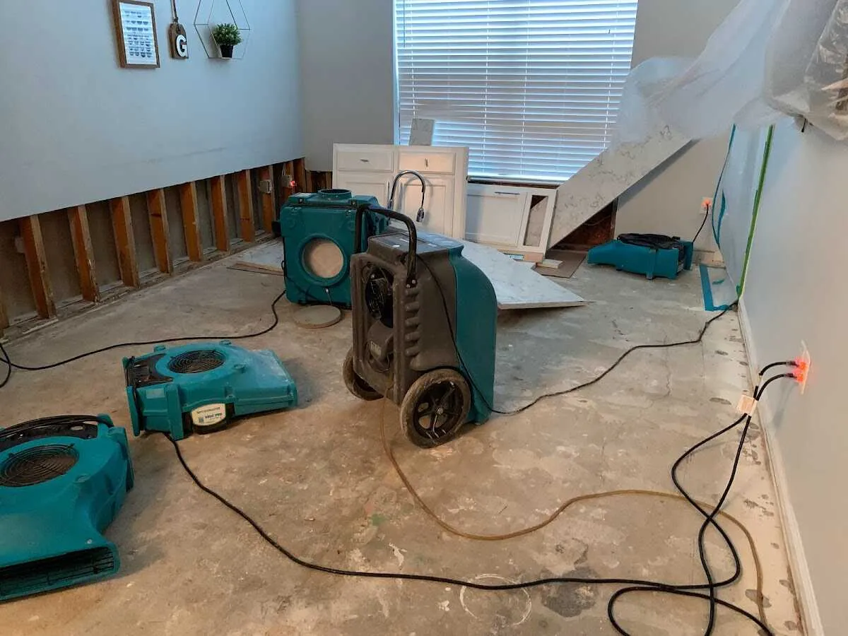 Dehumidifier in flood-cut room for Water Damage Restoration in East Moline